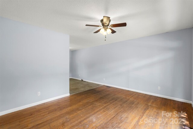 1075 Parkview Dr, Gastonia, NC 28054 - empty room with ceiling fan, baseboards, and wood finished floors