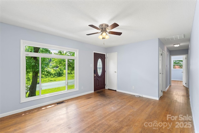 1075 Parkview Dr, Gastonia, NC 28054 - foyer featuring baseboards, ceiling fan, wood finished floors, and a textured ceiling