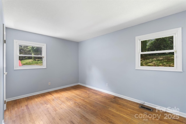 1075 Parkview Dr, Gastonia, NC 28054 - unfurnished room featuring baseboards and hardwood / wood-style flooring