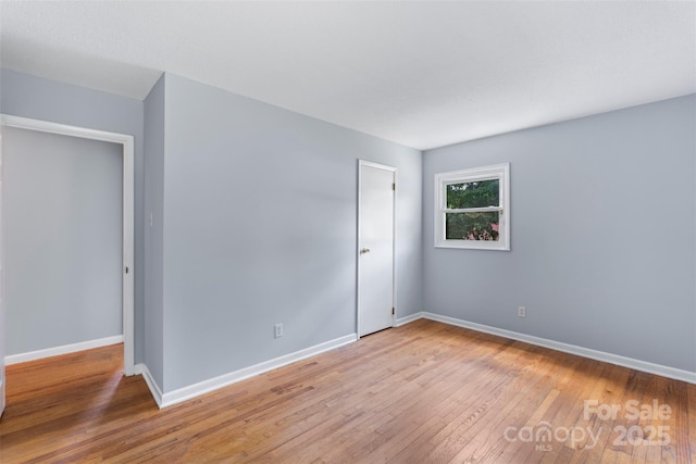 1075 Parkview Dr, Gastonia, NC 28054 - unfurnished bedroom featuring wood-type flooring and baseboards