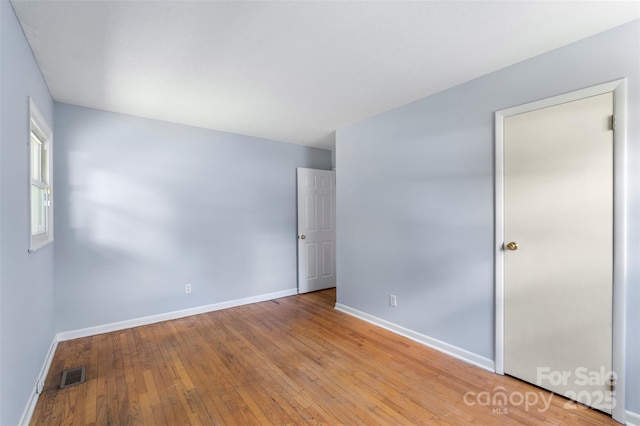 1075 Parkview Dr, Gastonia, NC 28054 - unfurnished bedroom featuring baseboards and hardwood / wood-style flooring