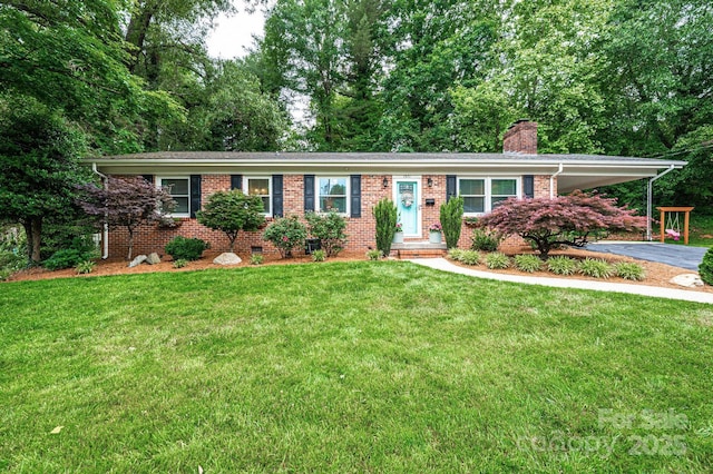 ranch-style house with a chimney, driveway, brick siding, a front lawn, and an attached carport