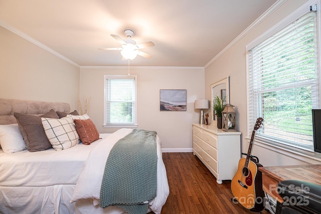 bedroom with dark wood-style floors, ornamental molding, baseboards, and a ceiling fan