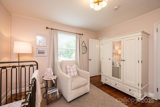 living area featuring dark wood-style flooring and ornamental molding