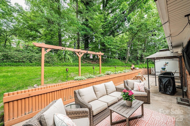 deck with outdoor lounge area, a lawn, a patio, a gazebo, and view of wooded area