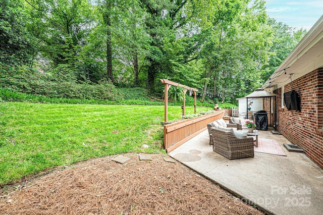 view of green lawn with a patio area and an outdoor hangout area