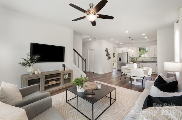 3004 Marlowe Ave, Charlotte, NC 28208 - living room with stairway, dark wood finished floors, ceiling fan, recessed lighting, and baseboards