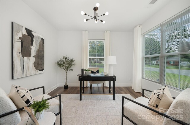 3004 Marlowe Ave, Charlotte, NC 28208 - home office with a chandelier, plenty of natural light, and wood finished floors