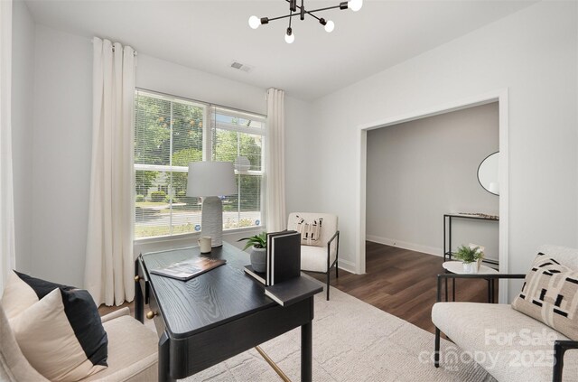 3004 Marlowe Ave, Charlotte, NC 28208 - office area with a chandelier, wood finished floors, and baseboards