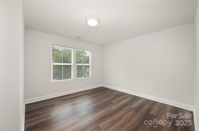 3004 Marlowe Ave, Charlotte, NC 28208 - spare room featuring dark wood-style flooring and baseboards
