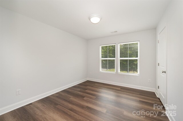 3004 Marlowe Ave, Charlotte, NC 28208 - unfurnished room with baseboards and dark wood finished floors