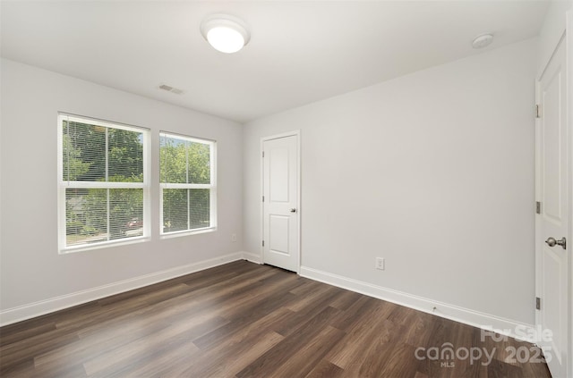 3004 Marlowe Ave, Charlotte, NC 28208 - spare room featuring dark wood-type flooring and baseboards