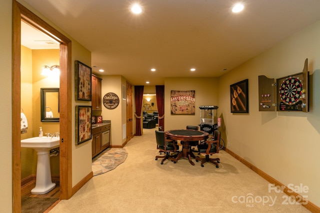dining space featuring recessed lighting, light colored carpet, and baseboards