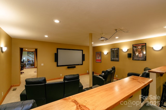 cinema room featuring recessed lighting, light carpet, and baseboards