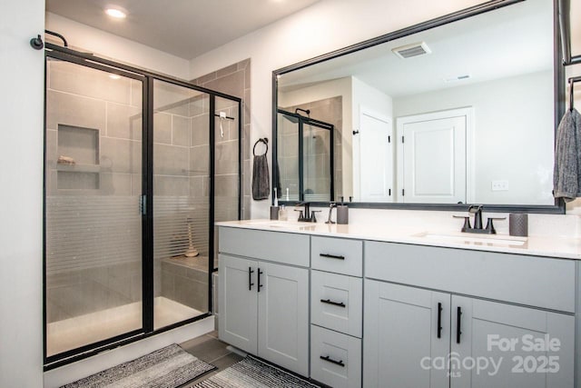 11951 Old Statesville Rd, Huntersville, NC 28078 - bathroom with a shower stall, double vanity, and recessed lighting