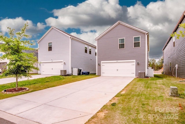 11951 Old Statesville Rd, Huntersville, NC 28078 - view of side of property with a garage, cooling unit, a lawn, and concrete driveway