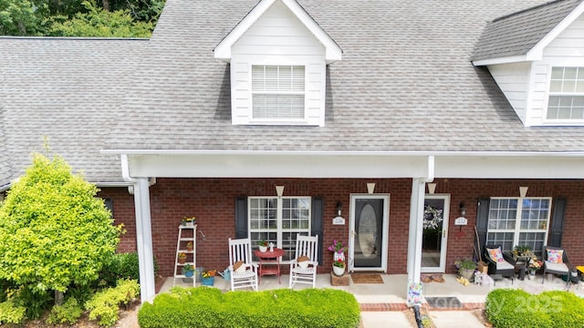 556 Knighton Hill Rd, Rock Hill, SC 29732 - view of front of house with a porch, brick siding, and roof with shingles