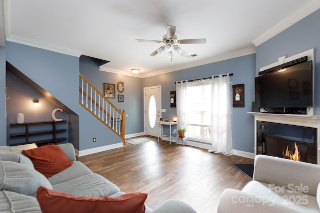 556 Knighton Hill Rd, Rock Hill, SC 29732 - living area with stairway, ceiling fan, ornamental molding, a lit fireplace, and wood finished floors