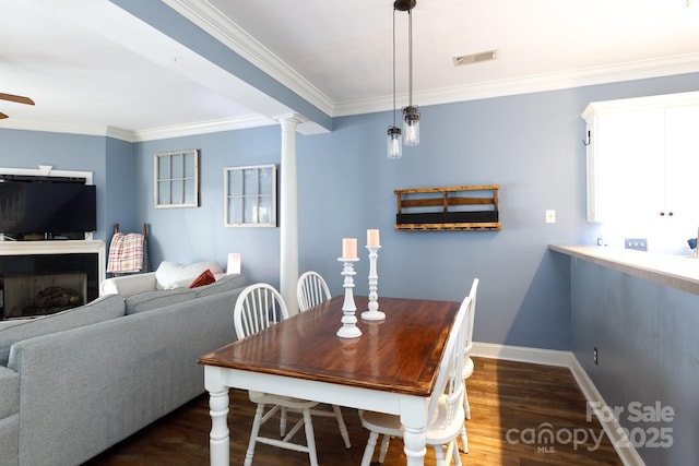 556 Knighton Hill Rd, Rock Hill, SC 29732 - dining room with crown molding, wood finished floors, ornate columns, baseboards, and ceiling fan