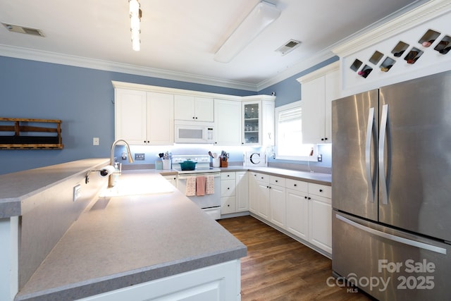 556 Knighton Hill Rd, Rock Hill, SC 29732 - kitchen with white appliances, a sink, a peninsula, ornamental molding, and white cabinets