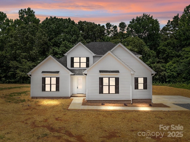 4975 Rimer Rd Unit 1, Concord, NC 28025 - modern farmhouse style home featuring board and batten siding, a yard, and a shingled roof