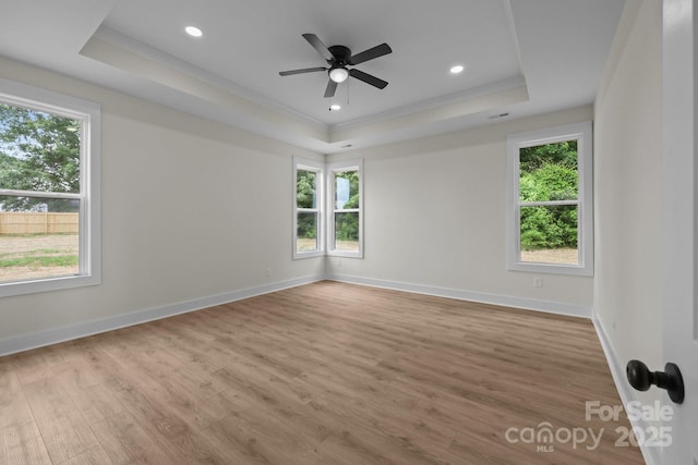 4975 Rimer Rd Unit 1, Concord, NC 28025 - unfurnished room featuring a raised ceiling, wood finished floors, ceiling fan, recessed lighting, and crown molding