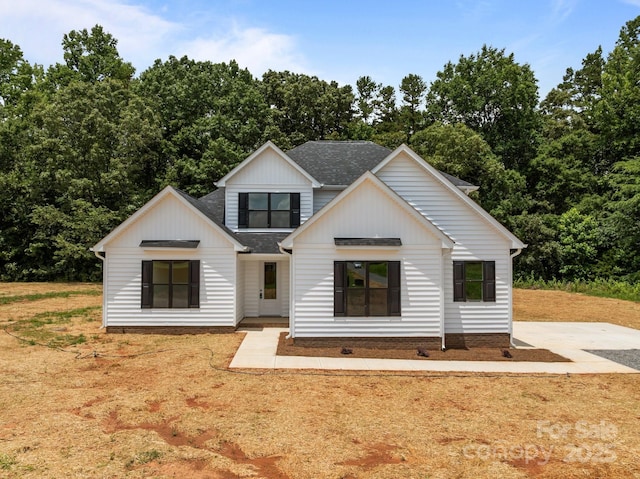 4975 Rimer Rd Unit 1, Concord, NC 28025 - modern inspired farmhouse featuring a shingled roof and board and batten siding