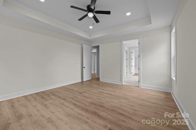 4975 Rimer Rd Unit 1, Concord, NC 28025 - unfurnished bedroom with a tray ceiling, light wood finished floors, recessed lighting, and a ceiling fan