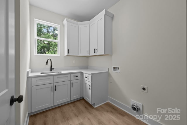 4975 Rimer Rd Unit 1, Concord, NC 28025 - washroom with light wood finished floors, hookup for an electric dryer, cabinet space, and washer hookup