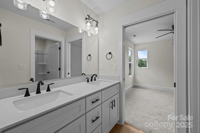 4975 Rimer Rd Unit 1, Concord, NC 28025 - bathroom featuring double vanity and baseboards