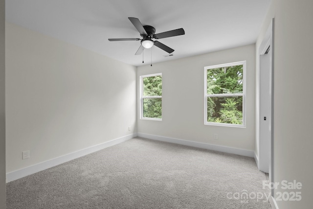 4975 Rimer Rd Unit 1, Concord, NC 28025 - carpeted spare room featuring baseboards and a ceiling fan