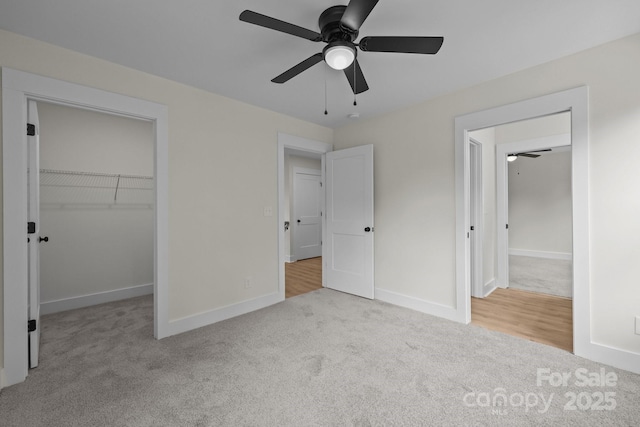 4975 Rimer Rd Unit 1, Concord, NC 28025 - unfurnished bedroom featuring carpet floors, a spacious closet, a closet, and a ceiling fan