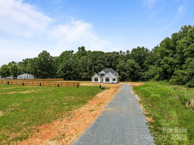 4975 Rimer Rd Unit 1, Concord, NC 28025 - view of front facade featuring a wooded view, gravel driveway, and a view of countryside