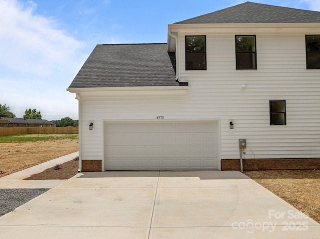 4975 Rimer Rd Unit 1, Concord, NC 28025 - view of side of home featuring a shingled roof and concrete driveway