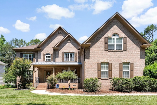 6300 Latta Springs Cir, Huntersville, NC 28078 - view of front facade with brick siding, a front yard, and a porch