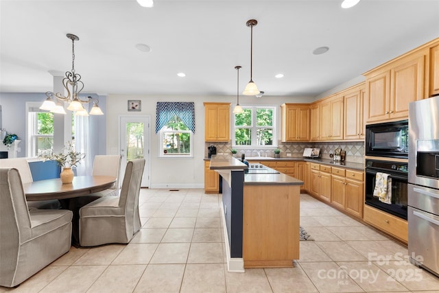 6300 Latta Springs Cir, Huntersville, NC 28078 - kitchen featuring black appliances, decorative backsplash, light brown cabinetry, a chandelier, and recessed lighting