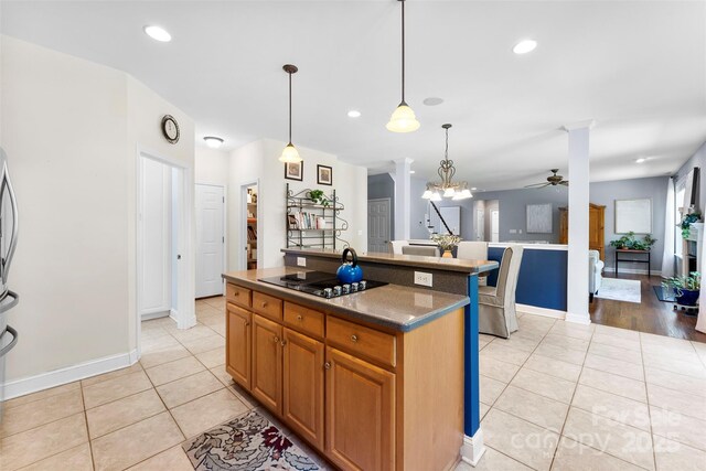 6300 Latta Springs Cir, Huntersville, NC 28078 - kitchen featuring black electric cooktop, ceiling fan, light tile patterned flooring, decorative light fixtures, and recessed lighting