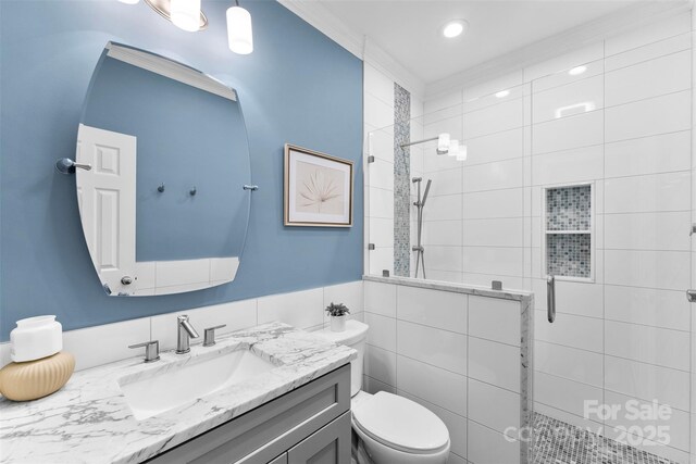 6300 Latta Springs Cir, Huntersville, NC 28078 - bathroom with a tile shower, vanity, toilet, recessed lighting, and tile walls