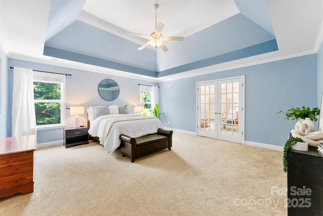6300 Latta Springs Cir, Huntersville, NC 28078 - bedroom featuring a tray ceiling, baseboards, ornamental molding, carpet floors, and french doors