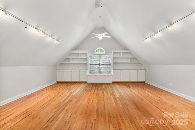 6300 Latta Springs Cir, Huntersville, NC 28078 - bonus room featuring baseboards, light wood-type flooring, ceiling fan, lofted ceiling, and built in shelves