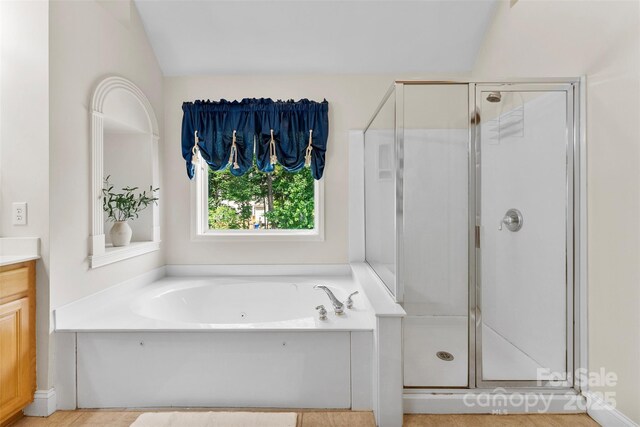 6300 Latta Springs Cir, Huntersville, NC 28078 - full bathroom featuring a stall shower, a garden tub, and vanity