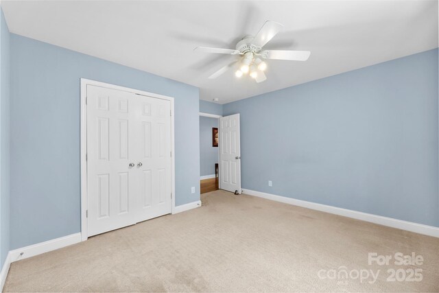 6300 Latta Springs Cir, Huntersville, NC 28078 - unfurnished bedroom featuring carpet flooring, baseboards, a closet, and a ceiling fan