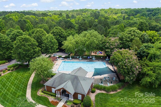 6300 Latta Springs Cir, Huntersville, NC 28078 - view of subject property with a heavily wooded area and a pool