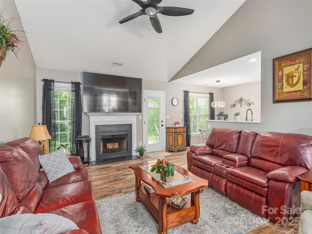 379 Running Briar Rd, Fletcher, NC 28732 - living area with wood finished floors, ceiling fan, vaulted ceiling, and a fireplace
