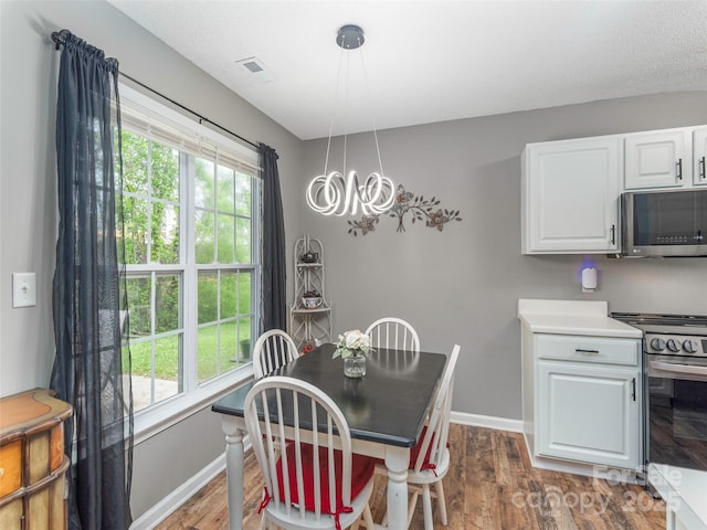 379 Running Briar Rd, Fletcher, NC 28732 - dining space with baseboards, dark wood-style floors, and a chandelier