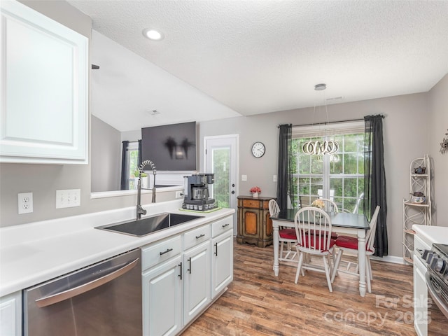 379 Running Briar Rd, Fletcher, NC 28732 - kitchen with stainless steel dishwasher, a sink, white cabinets, a textured ceiling, and light wood-type flooring