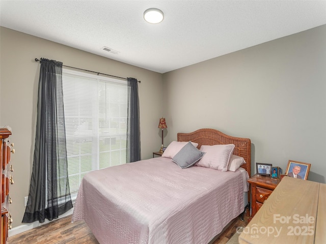 379 Running Briar Rd, Fletcher, NC 28732 - bedroom featuring wood finished floors and multiple windows
