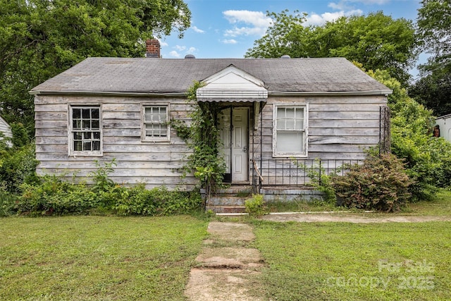 2308 Vanderbilt Rd, Charlotte, NC 28206 - view of front of house featuring a front yard and a chimney