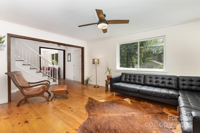 7015 Lavern St, Charlotte, NC 28215 - living room with hardwood / wood-style floors, a ceiling fan, crown molding, plenty of natural light, and stairs