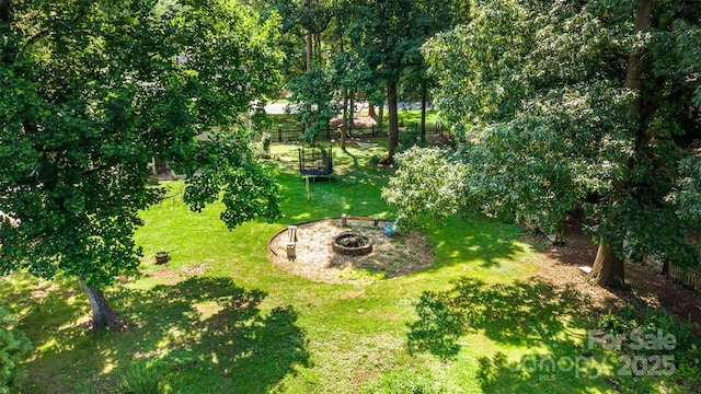 7015 Lavern St, Charlotte, NC 28215 - view of grassy yard with a fire pit